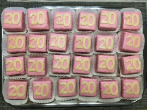 Punschkrapferl, a traditional Austrian pastry with pink glaze and the text